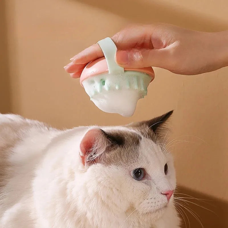 Blue silicone pet bathing brush with soft bristles for washing and massaging cats or dogs.