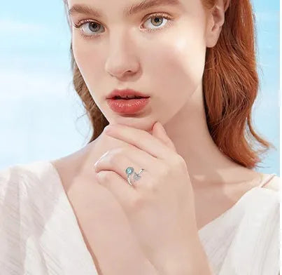 Rotating moonstone ring with adjustable opening, white gold electroplated finish, geometric circle and triangle design