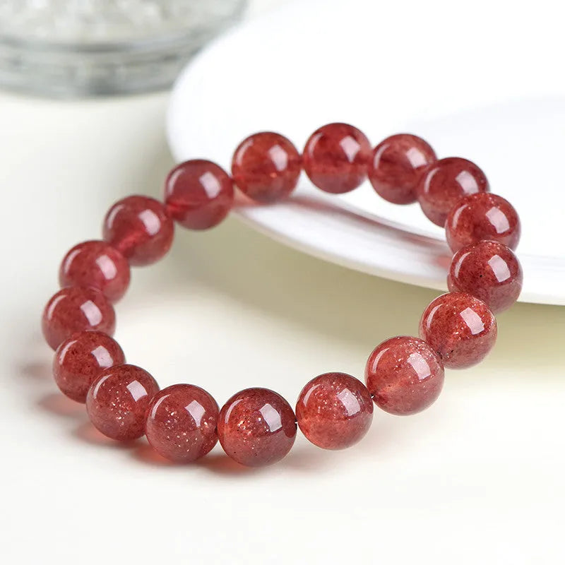 Natural strawberry quartz bracelet in starlight cherry red colour with geometrically shaped crystal beads