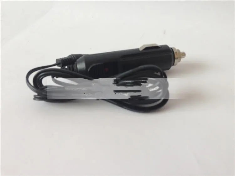 GKL112 model compact white 220V car charger with US plug on a wooden workbench.