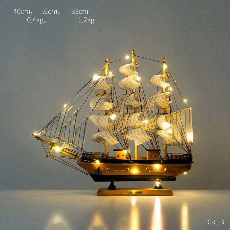 Wooden sailboat decoration in blue on a shelf, 20CM size from the craft display range