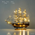 Wooden sailboat decoration in blue on a shelf, 20CM size from the craft display range
