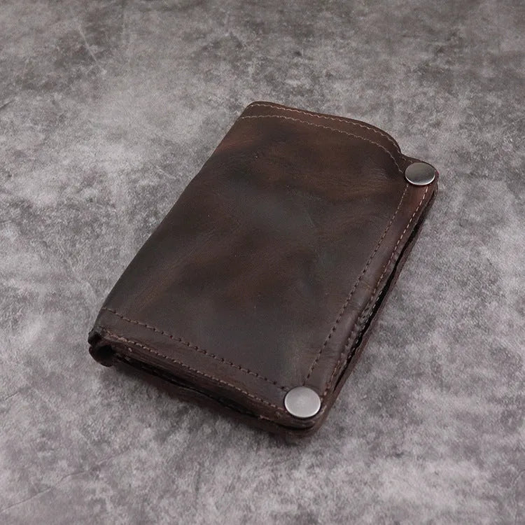 Men's retro-style long cowhide leather wallet open to show card slots, coin pocket, and bill compartment.
