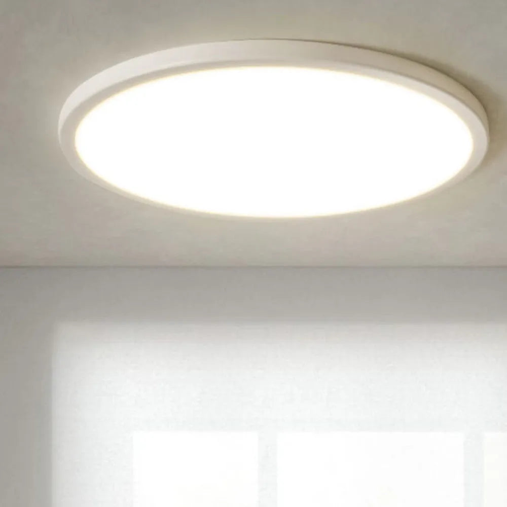 Ultra-thin round white LED ceiling lamp with aluminium frame and acrylic shade on ceiling