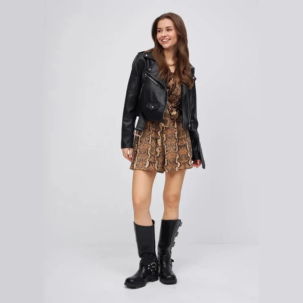 Black women's retro locomotive style jacket made from PU imitation leather on a model.