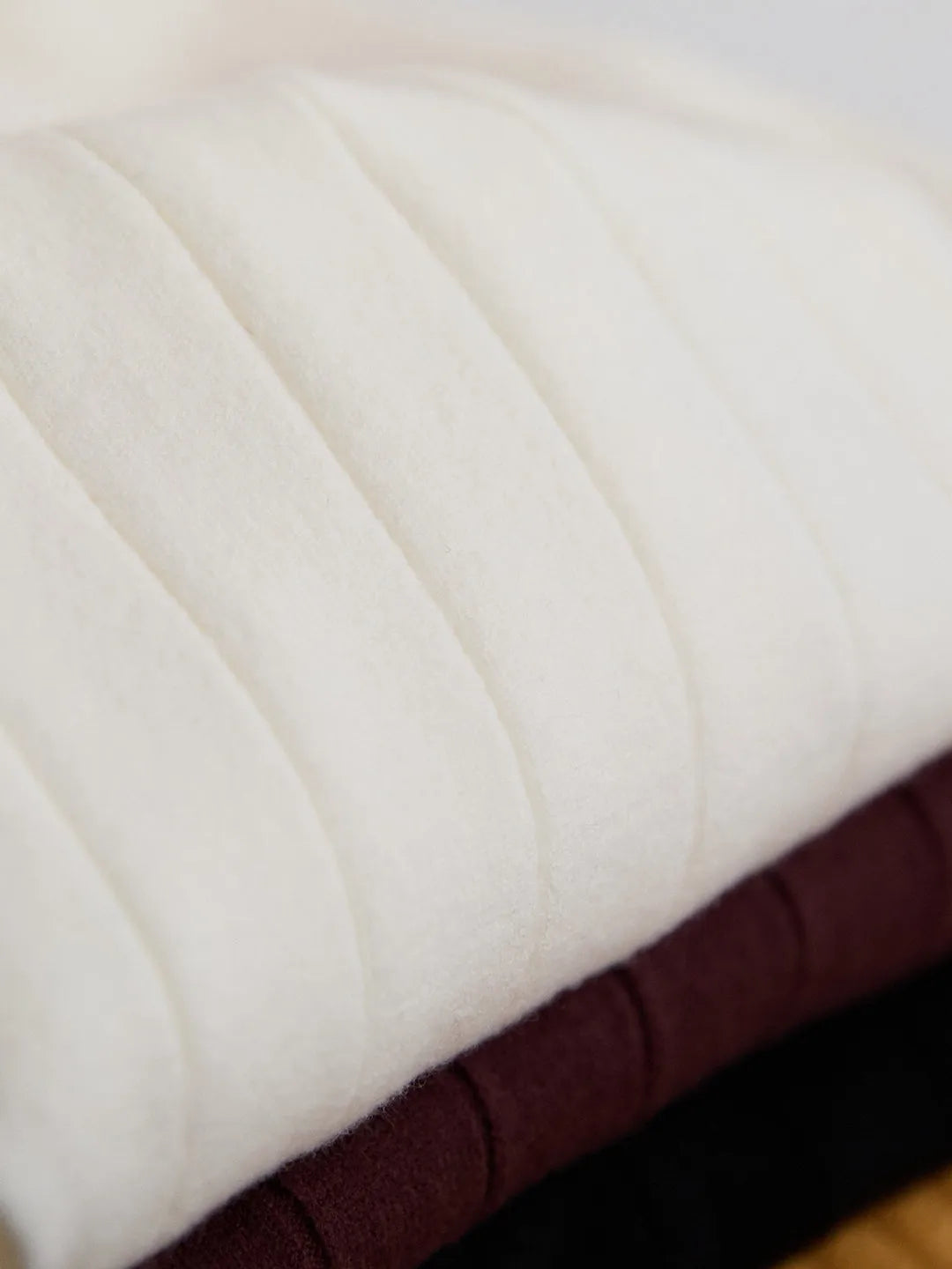 Half turtleneck wool blend knitted short sleeve T-shirt in chocolate colour, front view, on white background.