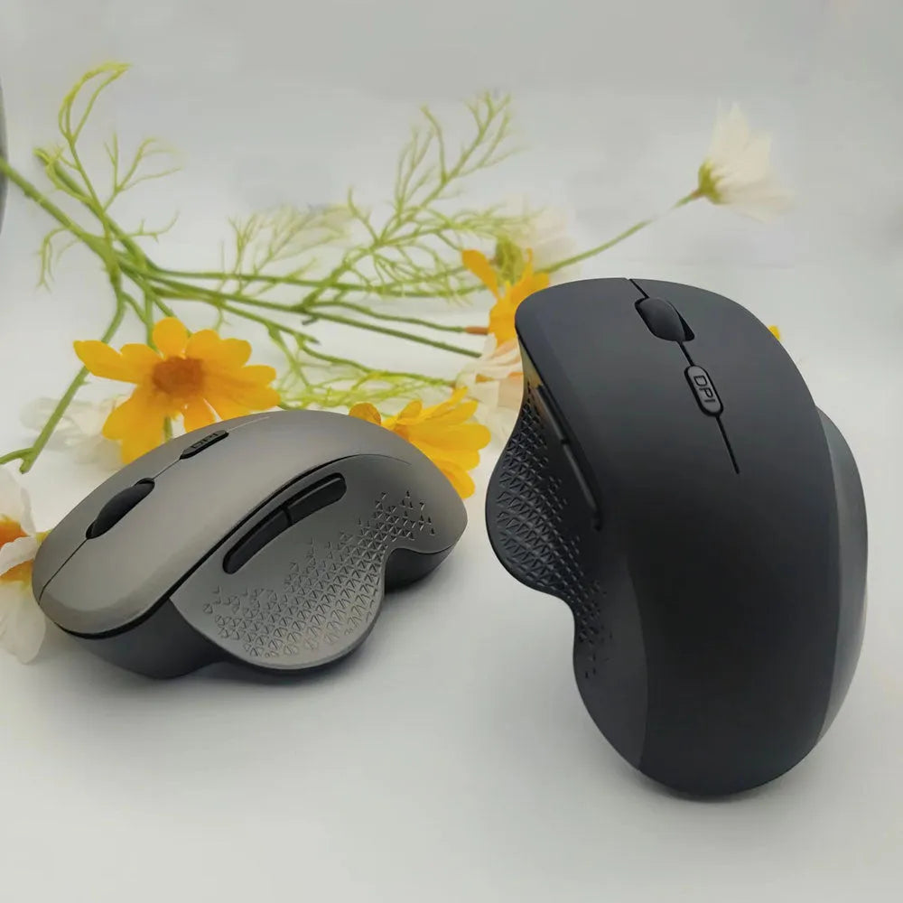 Black or grey wireless optical mouse with USB charging cable for laptop computers