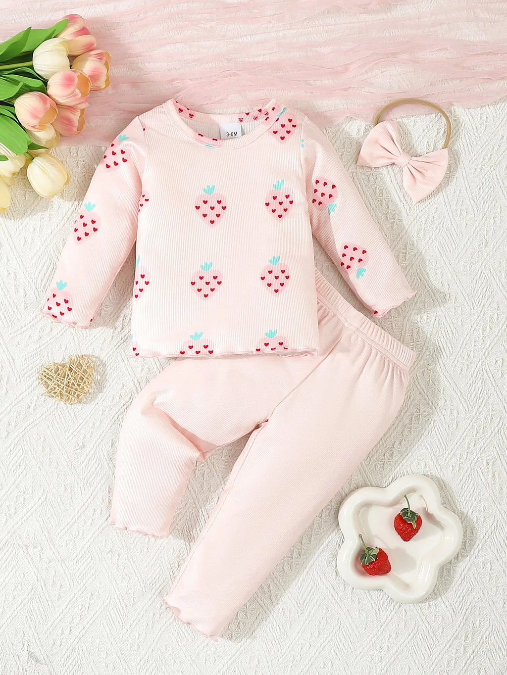 Infant wearing a light blue polyester 3-piece set with long sleeves, pants, and a matching hat.