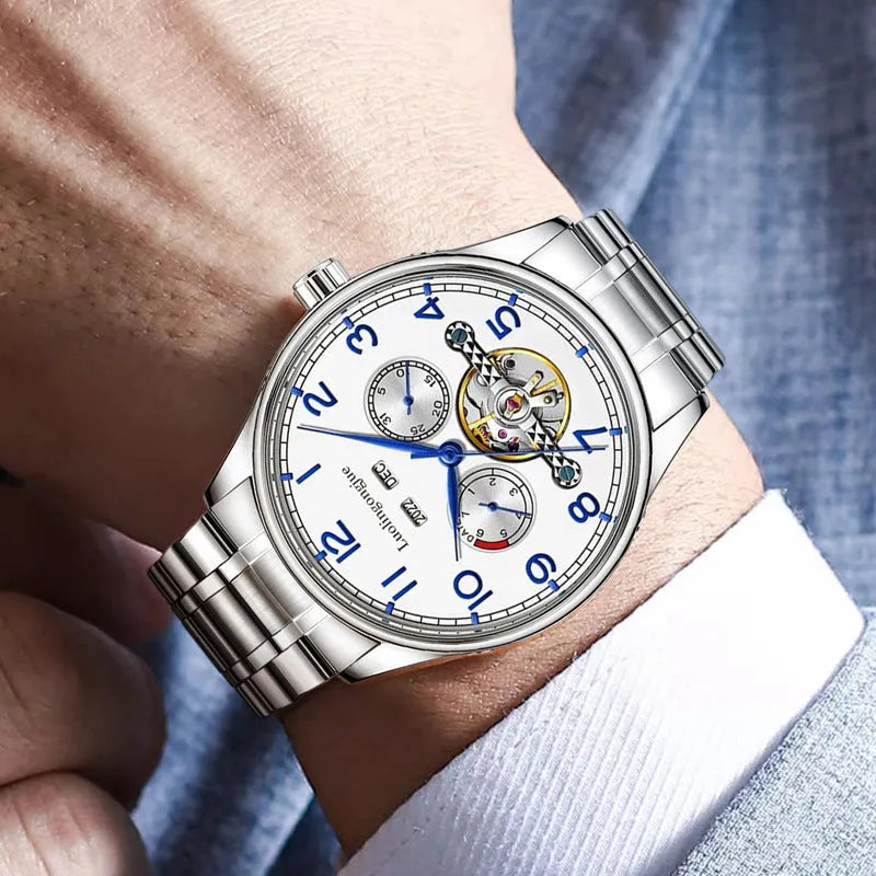 Men's silver stainless steel mechanical watch with white dial and brown leather strap.