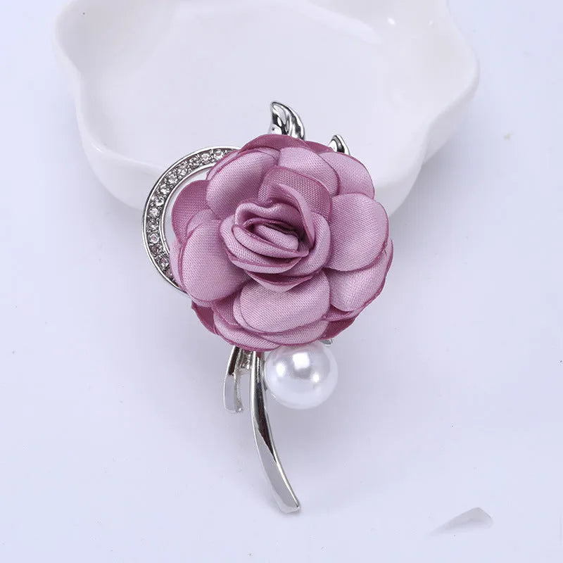 Rose brooch in Korean style, alloy construction, blue colour, 4.5cm by 3.8cm, on white background