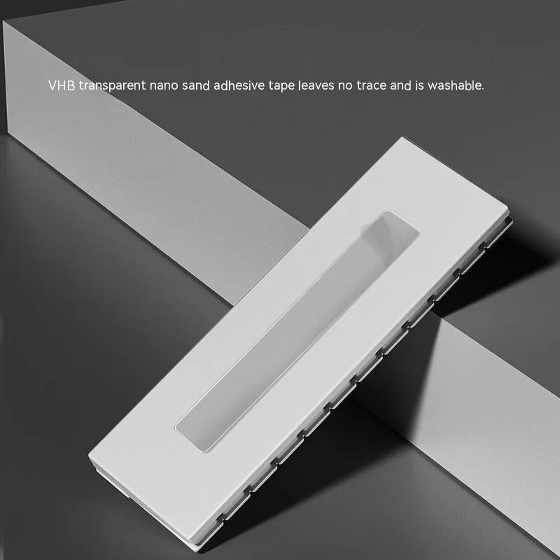 Black and white plastic piano-shaped parking sign with 'Piano Parking' text