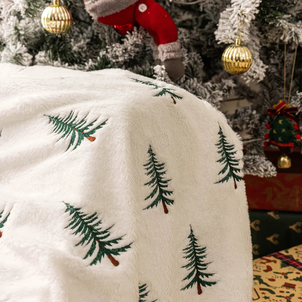 Christmas plush sofa blanket with embroidered tree design, white polyester, 127x152cm, on a sofa
