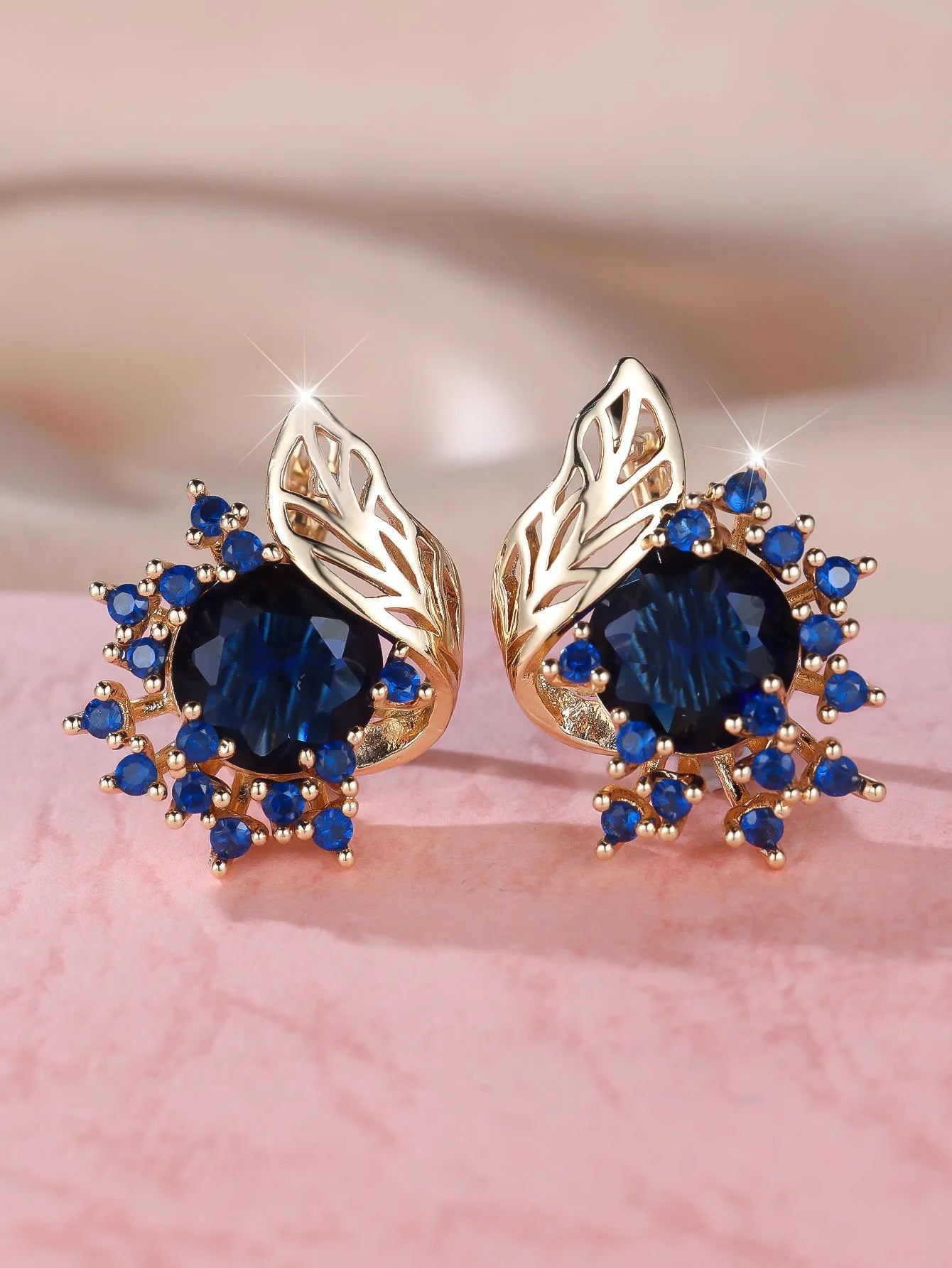 Rose gold round flower feather earrings with a choice of coloured zircon stones.
