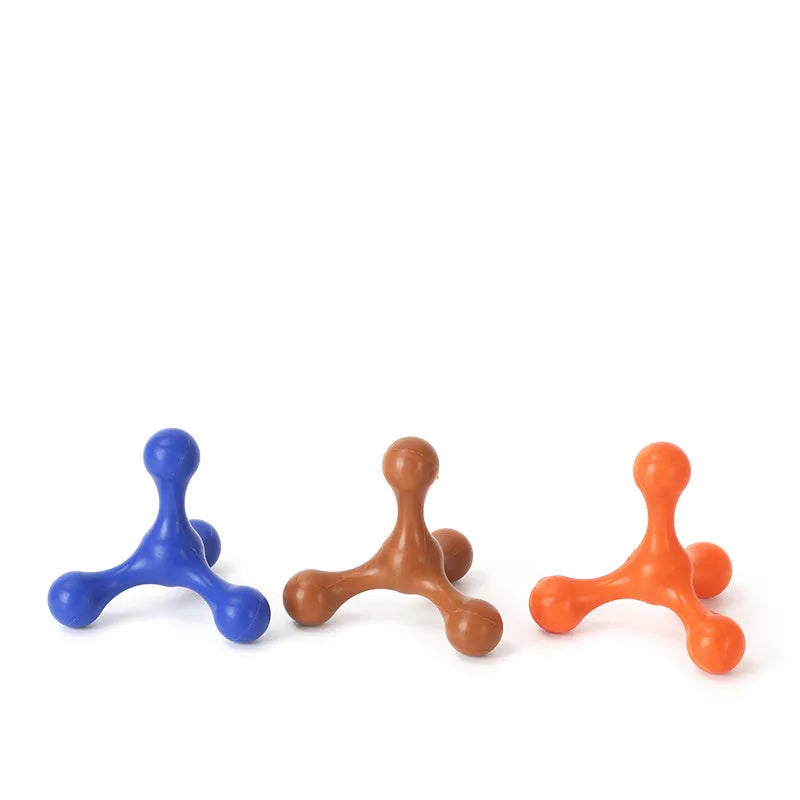 Blue silicone dog chew toy shaped like a bone with three legs, shown next to a small puppy.