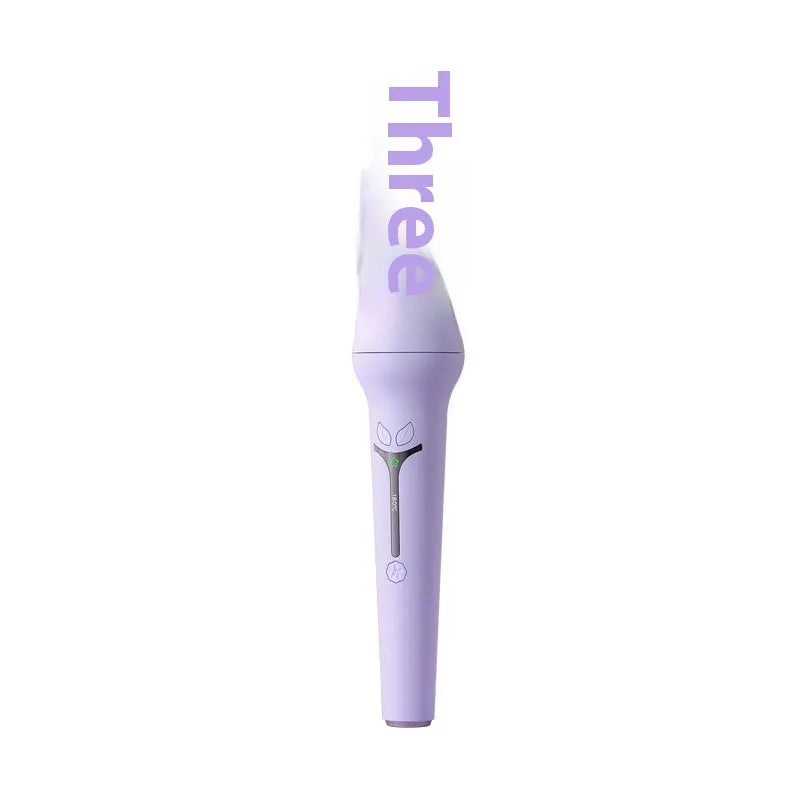 Pink automatic hair curler with 32mm barrel, three clips, and comb on white background