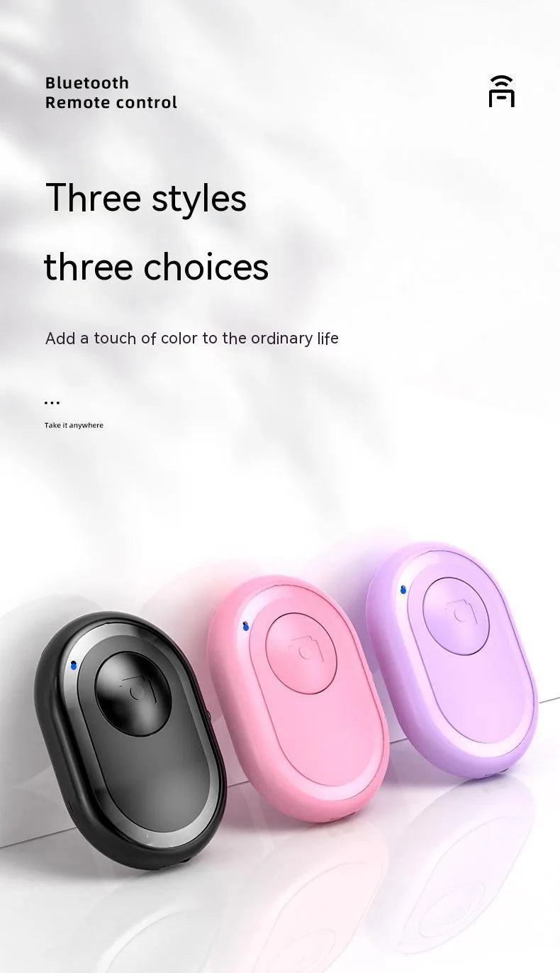 Wireless Bluetooth remote control for smartphone photography in black, pink, or purple colours