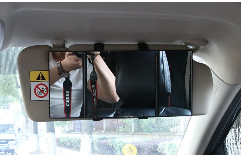 Silver folding makeup mirror shown both closed and opened, next to a car sun visor.