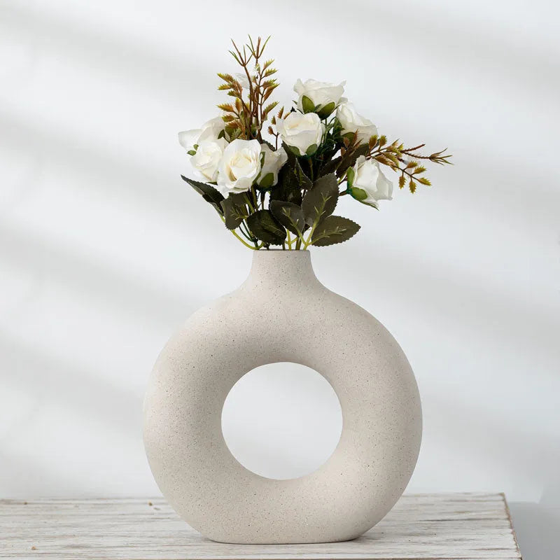 A simple modern frosted porcelain biscuit vase for flower arranging, shown in a neutral colour.