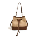 Woven straw women's crossbody bucket bag in brown colour showing horizontal square shape