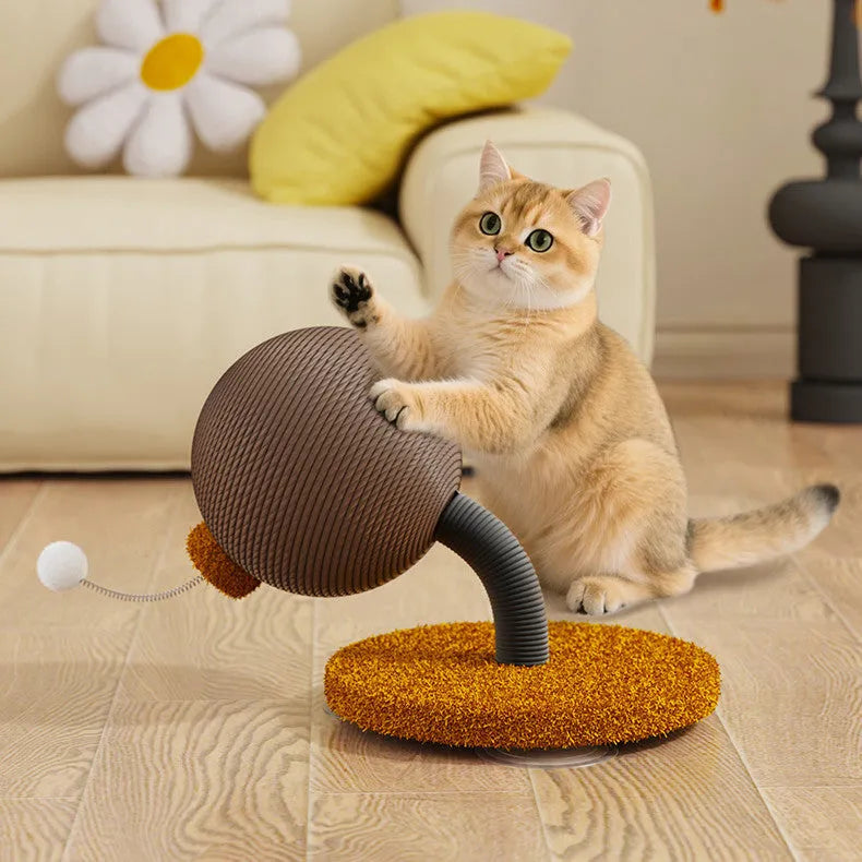 Natural hemp rope cat scratch board with attached toy ball on a wooden floor.