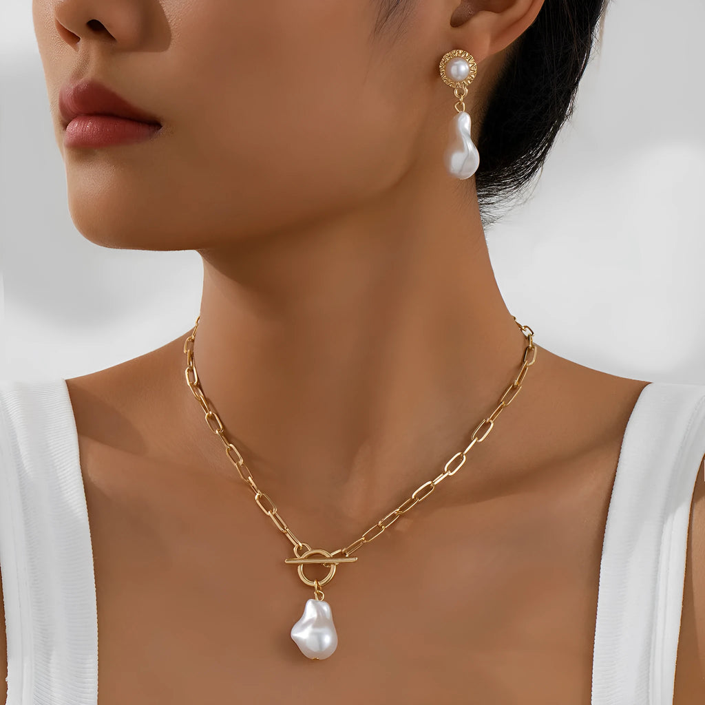 Gold colour baroque pearl pendant necklace and matching stud earrings set.