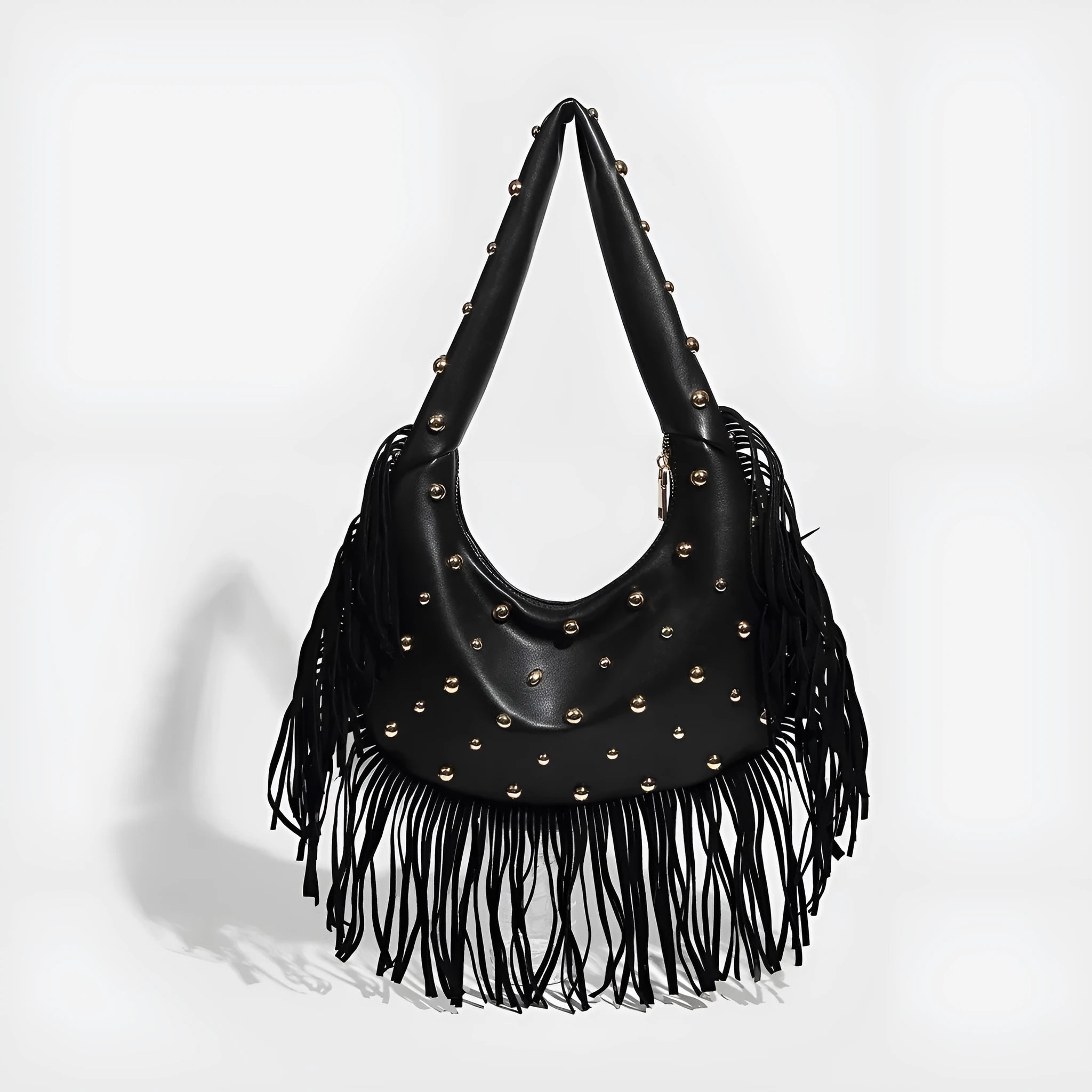 Retro-style black tassel shoulder handbag showing structured shape and decorative tassel.