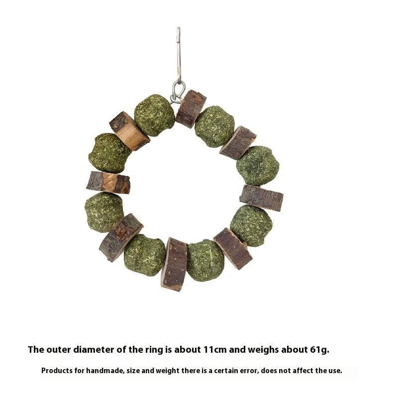 Hamster gnawing toy made of straw forming a ball ring, for small pets like guinea pigs.