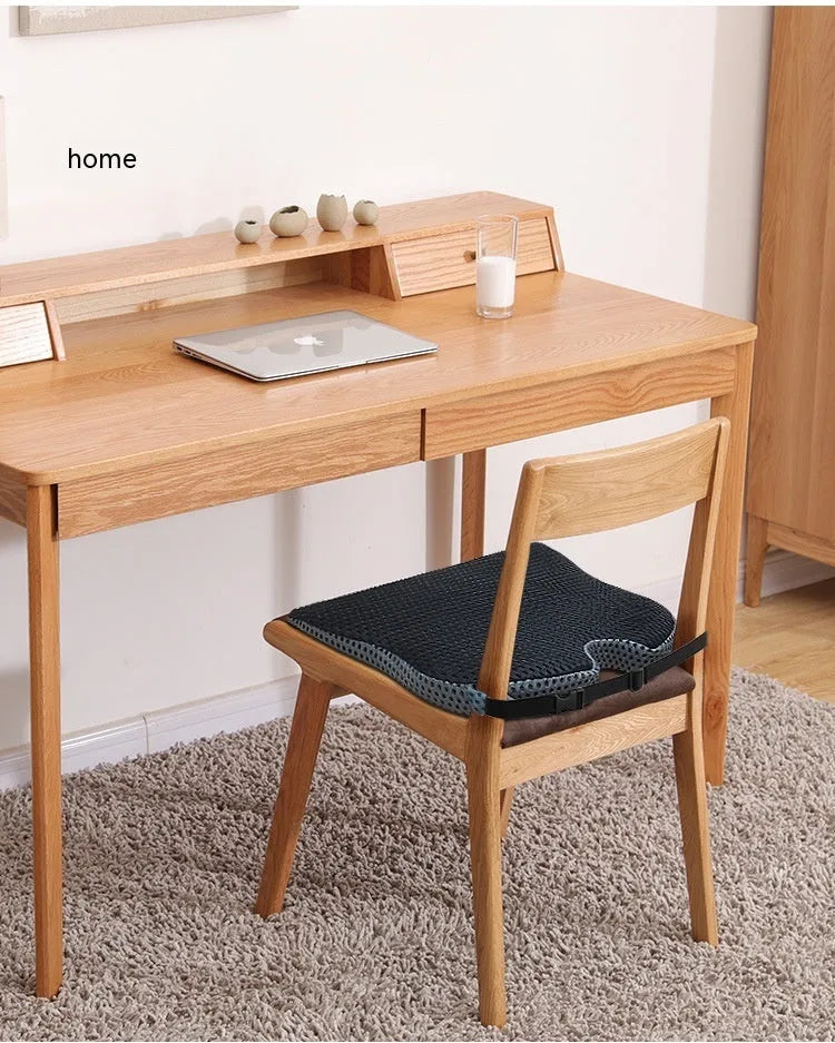 Memory foam lumbar cushion with straps on an office chair, shown in grey colour.