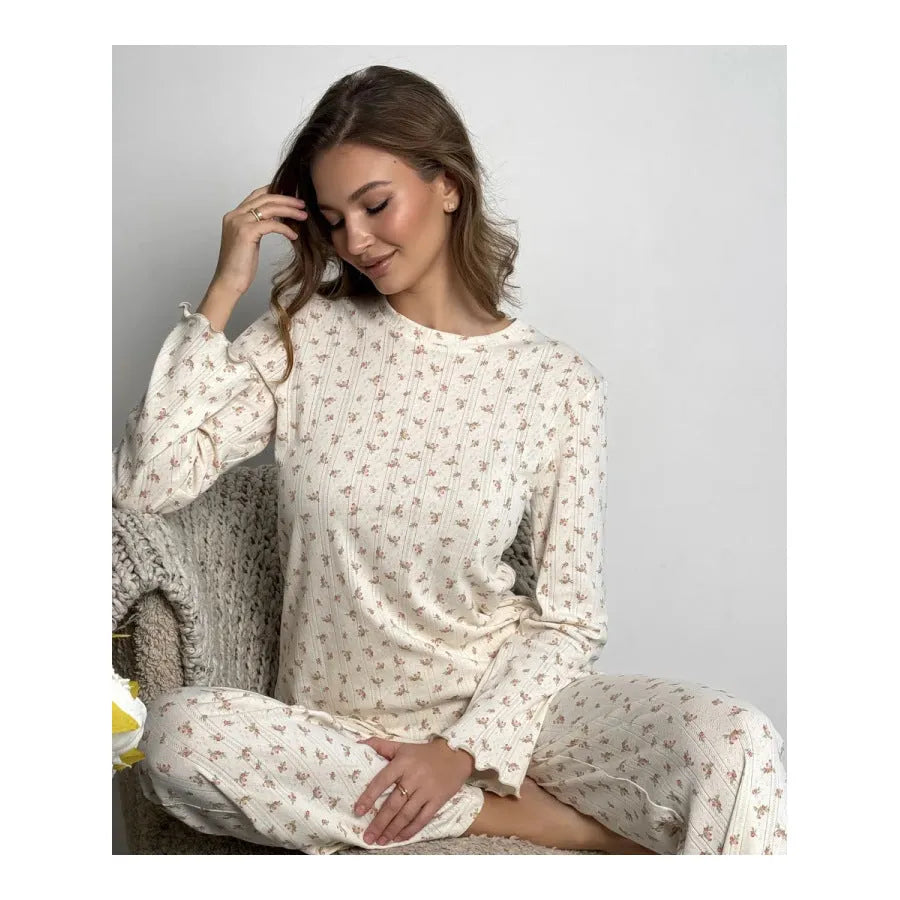 White floral print women's co-ord suit with bell sleeve top and wide leg trousers