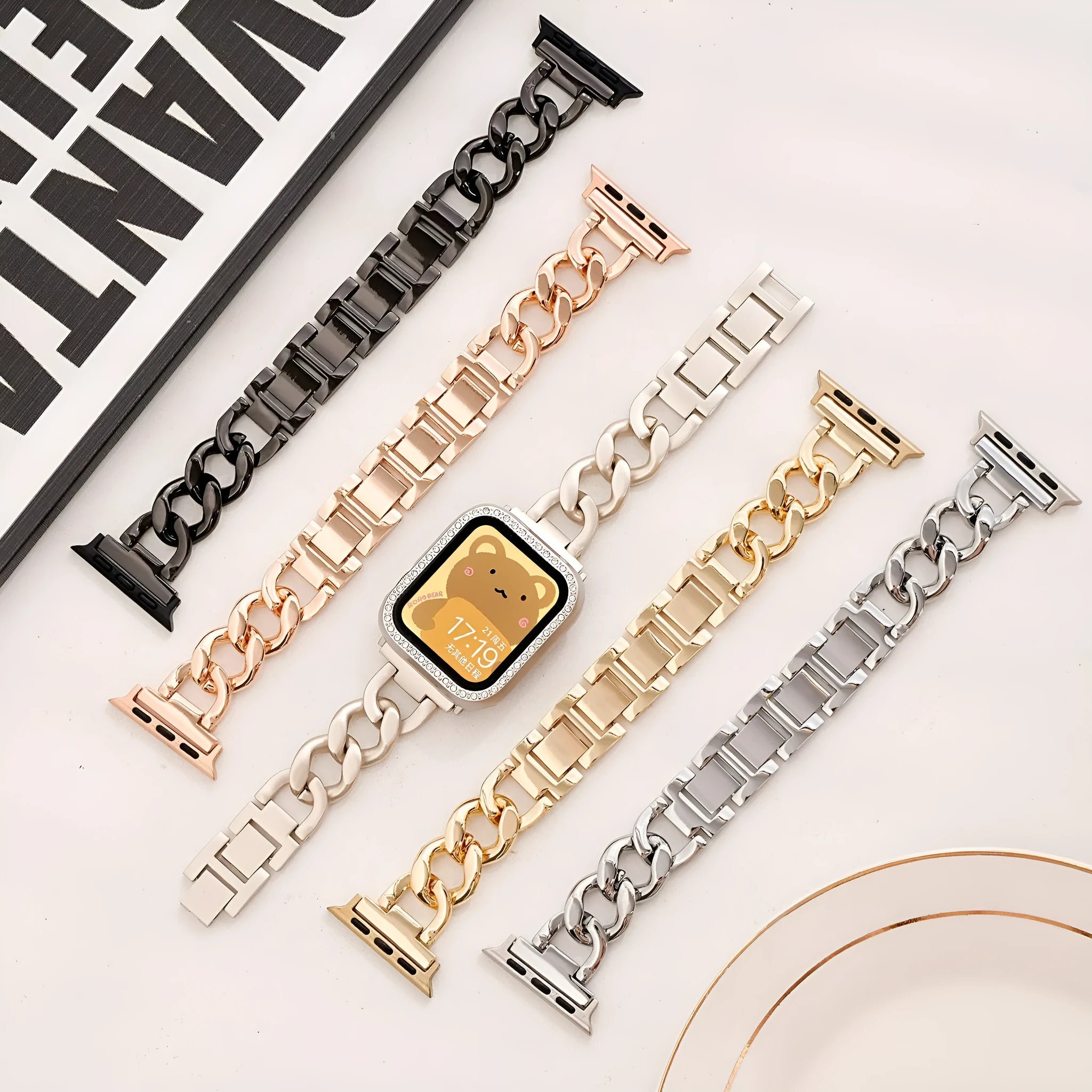 Metal denim chain watch strap for Apple Watch in multiple colours on a grey background.