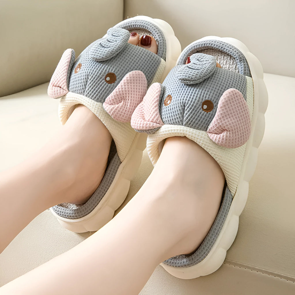 Elephant grey linen open-toe slippers for couples on a plain background, showing hand-sewn PVC sole.