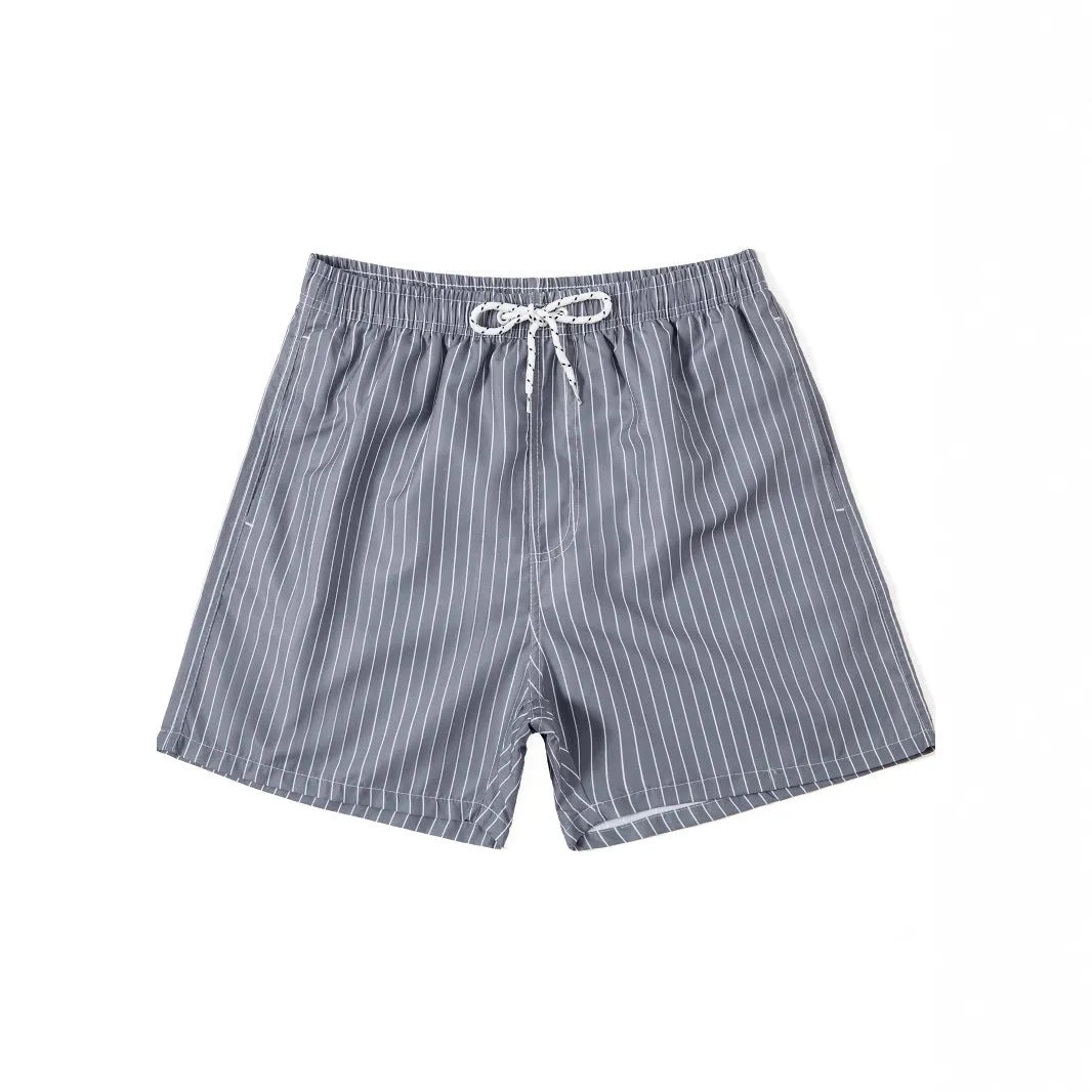 Polyester fibre beach shorts with striped triangle lining in straight leg design