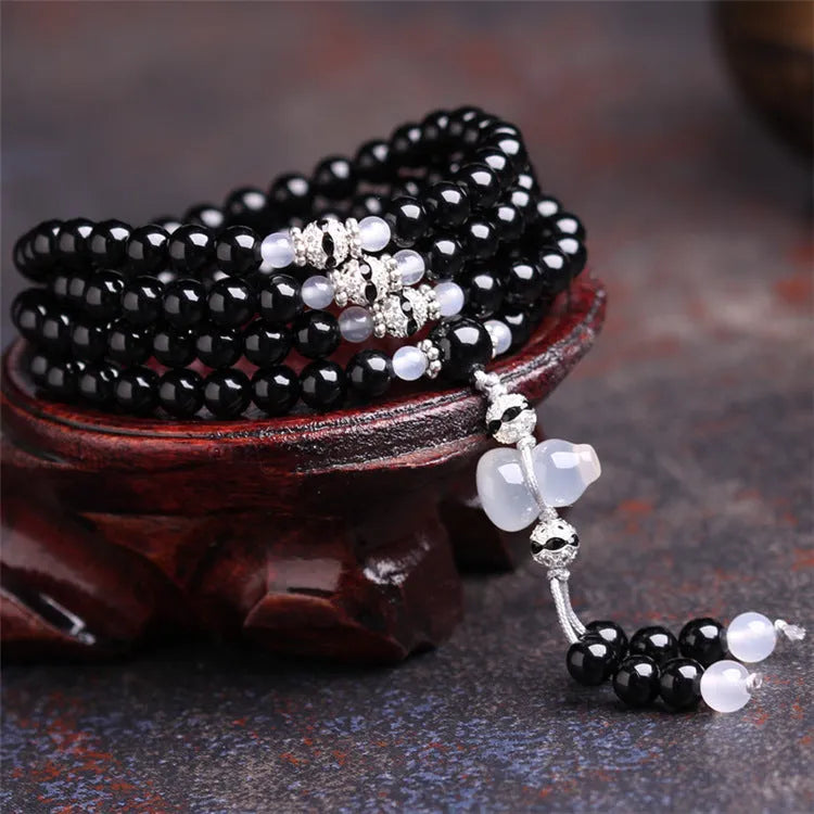 Black agate bracelet with 108 geometric natural stone beads on adjustable fastening