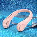 White bladeless neck fan hanging around a person's neck showing hands-free cooling design