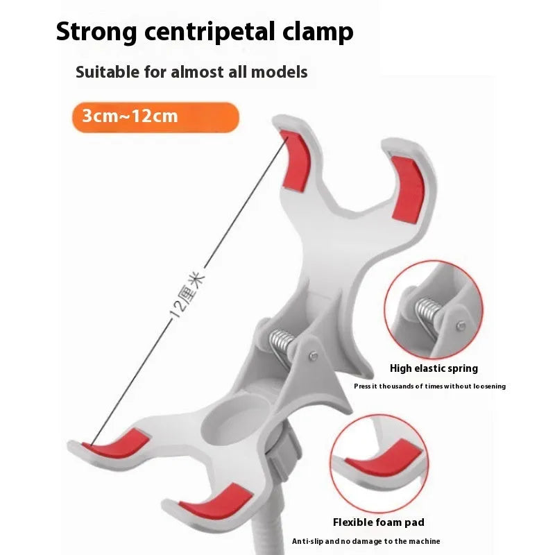 Black metal lazy stand gadget with rotary clip holding a mobile phone on a bedside table