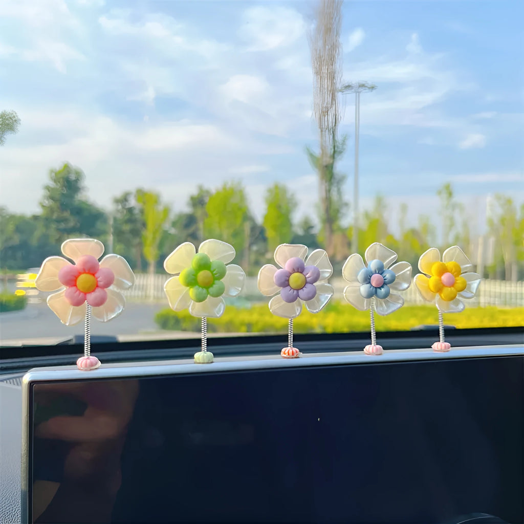 Small blue plastic swing ornament for car rear-view mirror, approx. 5cm tall.