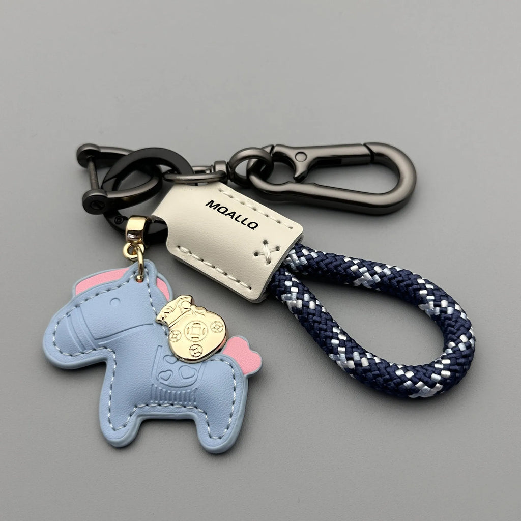Handmade brown cowhide key ring pendant with a zinc alloy pony belt buckle and green flanelle rope.
