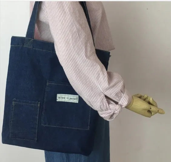 Shoulder bag with soft handle and inner patch pocket available in multiple colours including dark blue