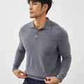 Man wearing a sapphire blue loose-fit cashmere pullover sweater with a polo collar.