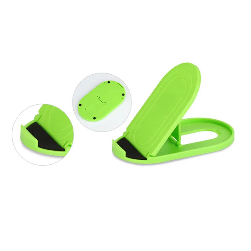Plastic lazy bracket mobile phone stand in multiple colour choices on a table.