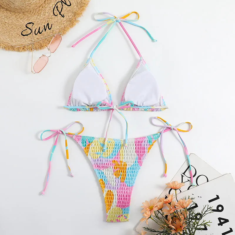 Women's triangle bikini swimming suit with floral gradient pattern and smocking craft detailing