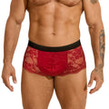 Men's black lace briefs with hollow-out see-through panels on a grey background.