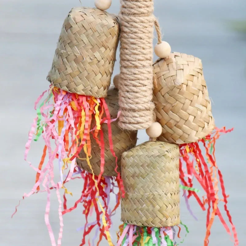 Shredded paper bird toy with colourful paper strips on wooden frame with sisal rope, measuring 15 by 35cm
