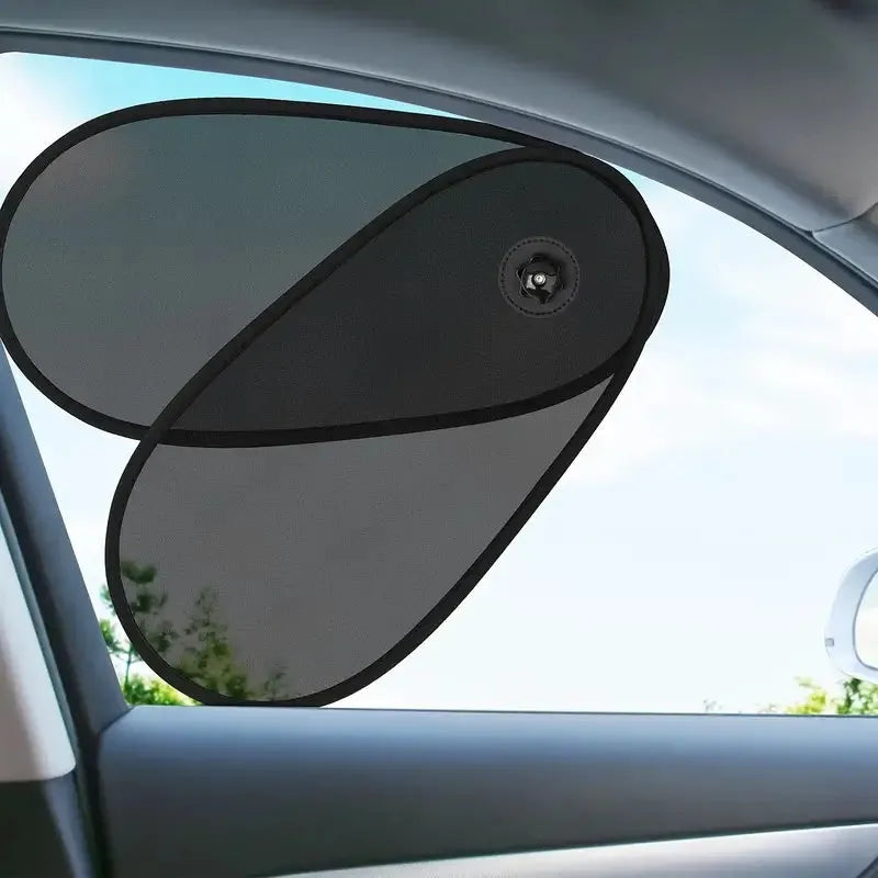Black stretchy car window shade with suction cups attached to a car side window.