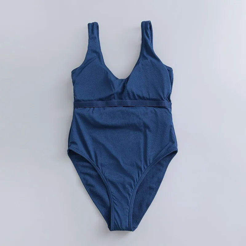 Navy blue women's one-piece swimsuit with triangle neckline and sleeveless design for swimming.