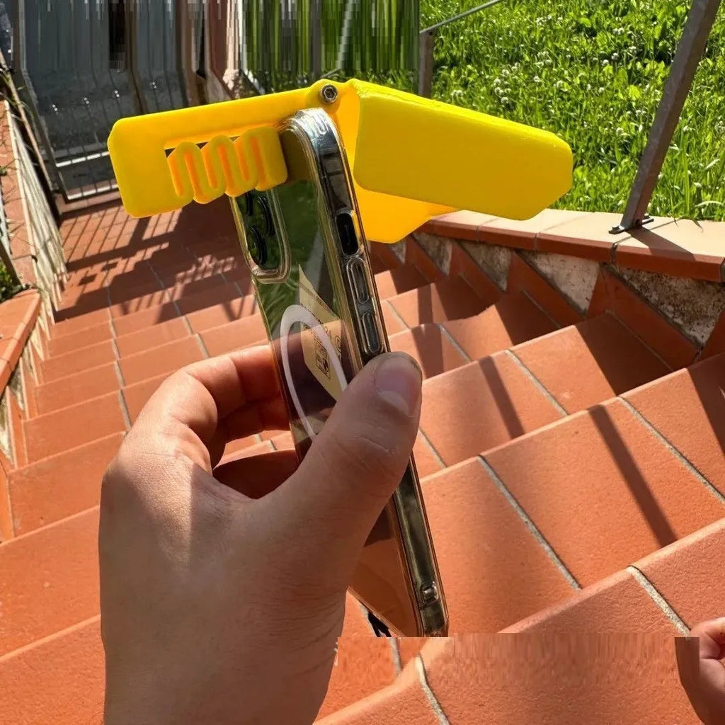 Yellow and black plastic phone sunshade holder with clip for beach and poolside use