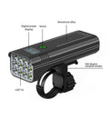 Black KX12DF digital display bicycle headlight with aluminium body mounted on bike handlebars via quick-release bracket.