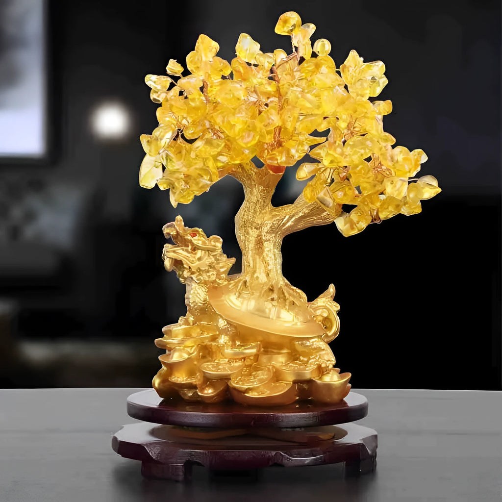 Citrine coloured small water turtle money tree resin ornament on a white background.