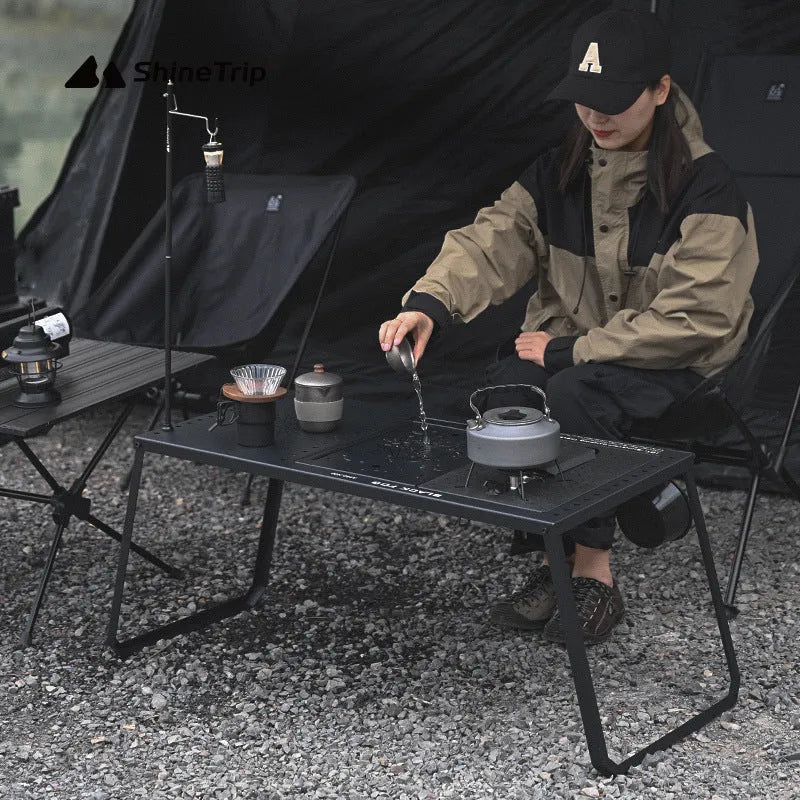 Folding carbon steel camping table with IGT modular system and multiple cell board design options.