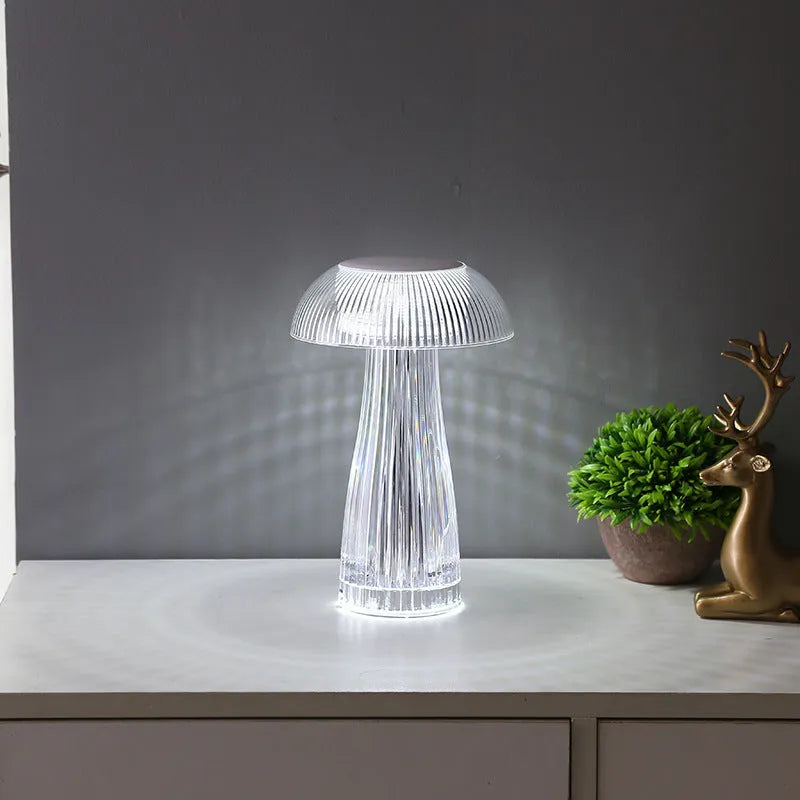 Creative crystal acrylic jellyfish table lamp with touch control and colour options on a desk